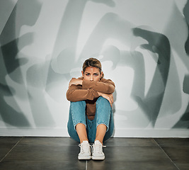 Image showing Anxiety, stress and fear of a woman overwhelmed with mental health issues on the floor. Person in a house with depression suffering from distress, sad and busy mind alone isolated in a home depressed