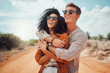Image showing Happy couple, hug and love, smile and travel on roadtrip to the outback of Australia. Adventure, fun and happiness for quality summer vacation time, boyfriend and girlfriend on a desert road.