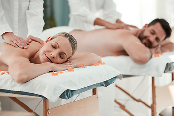 Image showing Spa, massage and relax with a couple on a bed for massaging, treatment or wellness in a health club. Luxury, beauty and rest with a man and woman relaxing in a clinic for peace, calm or wellbeing