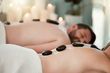 Image showing Hot stone, relax and couple with massage at spa for wellness, relax and skin therapy on holiday at a hotel. Man and woman sleeping during luxury natural cosmetics for skin and body health on vacation