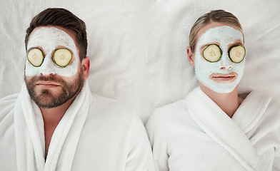 Image showing Love, relax and couple at spa with face mask for luxury wellness treatment together from above. Professional skincare facial for self care detox and relaxation on cosmetic salon bed in Canada.