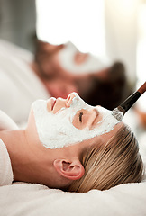 Image showing Facial, skincare and couple are calm at spa for wellness, body health, serenity and zen. Love, relax together and face treatment, eyes closed and relief of stress at beauty salon while on vacation.