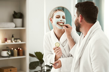 Image showing Happy couple playful, facial and relax at spa for wellness, skincare, love together and eating cucumber. Healthy fun relationship, luxury body care for calm, therapy and zen at health salon.