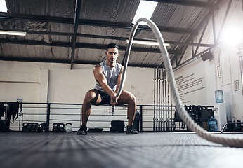 Image showing Man, workout and fitness with rope at gym for health, exercise and body wellness. Healthy, muscle and strong for development for athlete in mma, wrestling or sport at training club, class or studio