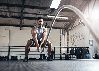 Image showing Rope, cardio and man training for fitness, body goal and health in the gym. Strong athlete with focus and energy doing exercise and workout for wellness, power and motivation at a sports club