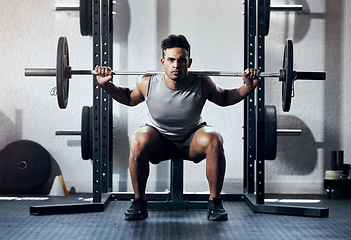 Image showing Weightlifting, gym and man strong in exercise, workout and training body. Fitness, muscle and motivation for health, wellness and sport in portrait of focus, determination and power for bodybuilder