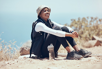 Image showing Black woman, view and hiking break on mountains, countryside environment and remote landscape in Namibia. Smile, happy and relax fitness hiker in exercise, training and health workout rest in nature