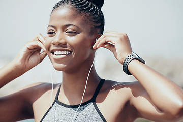 Image showing Music, motivation and black woman training for fitness with audio podcast in the city of Australia. Face of an African athlete runner running for cardio exercise while listening to the radio