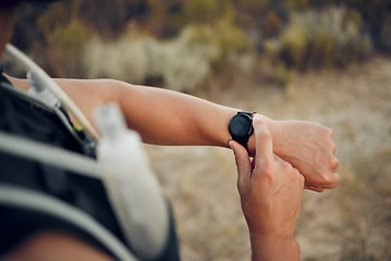 Image showing Man, hiking and nature with smartwatch for time on run, workout or race for sport. Technology, fitness and exercise for training, wellness and health on adventure with tech, gps or clock in Bogota