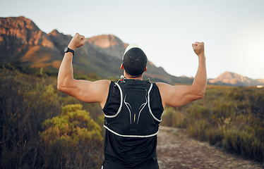 Image showing Winner, mountain and runner man success with back view celebrating cardio exercise goal victory. Muscular, strong and fitness lifestyle male running achievement celebration in South African bush.