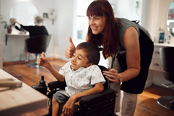 Image showing Hair salon, hairdresser and child in wheelchair with thumbs up after haircut. Hairdressing, barber and haircare for kid with disability. Support of accessibility, smile and thank you from happy boy