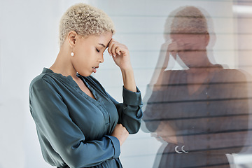 Image showing Black woman, stress and work with mental health, tired and anxiety by window depressed in office. Professional, career and sad girl frustrated with headache, burnout and depression at job in New York