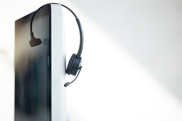 Image showing Computer, headphones and call center telemarketing background in office for contact us, virtual online consulting and sales agency. Zoom of customer service technology for receptionist communication