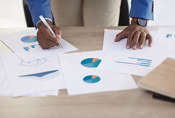 Image showing Businessman, hands and data on paper, analytics and graph for accounting in finance business on desk. Black man, working and writing on document for financial strategy, planning and economy of market