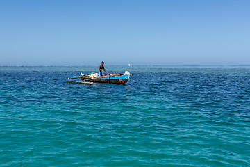 Image showing Fishermen using sailboats to fish off the coast of Anakao in Madagascar