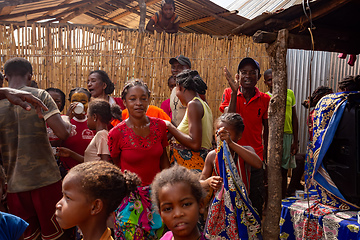 Image showing Women in colorful dresses dance at a rural village party in Bekopaka, Madagascar