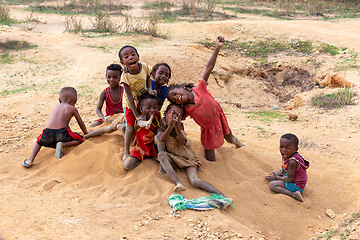 Image showing Curious group of children looking at a tourist in Ilakaka. Madagascar