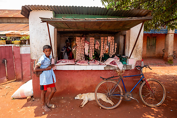 Image showing Woman buys meat from a street butchery in Mandoto, Madagascar.