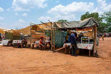 Image showing Street market in Mandoto city, with vendors and ordinary people shopping and socializing. This image portrays the local fast food in street marketplace.