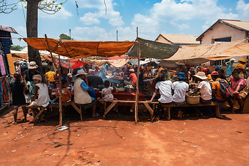 Image showing Street market in Mandoto city, with vendors and ordinary people shopping and socializing. This image portrays the local fast food in street marketplace.