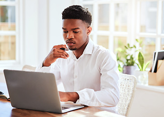 Image showing Office, laptop and african businessman working on a project and doing research on the internet. Technology, young and professional black man reading corporate company documents on his computer.