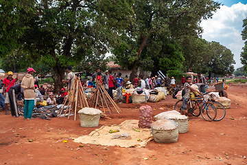 Image showing Street market in Mandoto city, with vendors and ordinary people shopping and socializing. This image portrays the local lifestyle and economy of Madagascar.