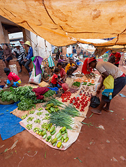 Image showing Street market in Mandoto city, with vendors and ordinary people shopping and socializing. This image portrays the local lifestyle and economy of Madagascar.