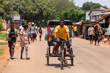 Image showing Traditional rickshaw on the Mandoto city streets. Rickshaws are a common mode of transport in Madagascar.