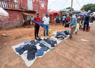 Image showing Street market in Mandoto city, with vendors and ordinary people shopping and socializing. This image portrays the local lifestyle and economy of Madagascar.