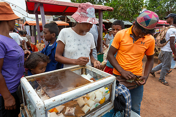 Image showing Malagasy man sell milk product from simple cooling case on the street of Mandoto.