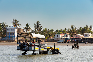 Image showing Modern tractor with tourists in Toliara port, Madagascar.