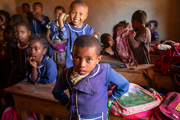 Image showing Happy Malagasy school children students in classroom. School attendance is compulsory, but many children do not go to school.