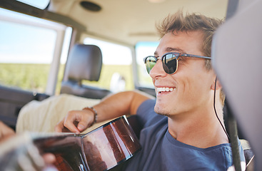 Image showing Music, guitar and young man in car on a roadtrip adventure in nature. Summer, holiday and journey on the road, fun musician on vacation. Travel, freedom and explore nature with musical instrument