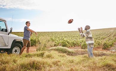 Image showing Friends on a trip, travel and play football in nature on field in countryside. Fun, care free men playing together and relaxation on holiday break for bonding in serene landscape in summer.