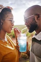 Image showing Couple, drink and date with a black woman and man drinking a beverage while outdoor in nature during summer. Dating, romance and together with a boyfriend and girlfriend using a straw closeup