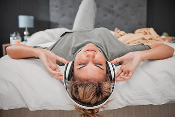 Image showing Sleep music, bed and woman listening to audio podcast with headphones in the bedroom of her house. Sleeping girl streaming calm radio sound for peace, relax and content mind with wifi in home