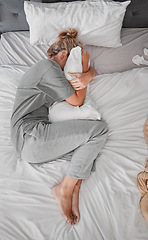 Image showing Sad, depression and woman with insomnia after divorce in the bed in house from above. Top view of depressed, tired and sick girl with stress, burnout or mental health problem in the bedroom