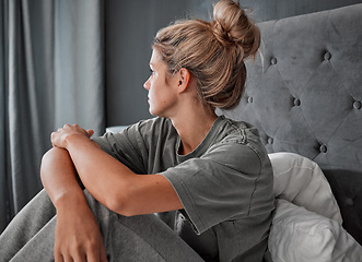 Image showing Depression, thinking and sad girl on bed alone and mental health mindset with anxiety problem in home. Young woman in mental isolation from fear, worry and stress about thoughts or idea in mind