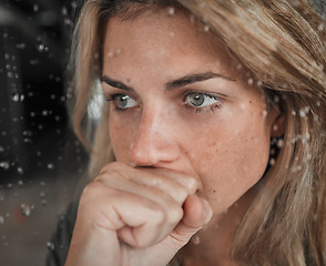 Image showing Stress, anxiety and mental health woman by window in house, home and psychology support asylum thinking while watching rain. Zoom, fear face or depression of sad, scared or burnout person in lockdown