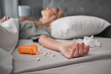 Image showing Depression, mental health and overdose with pills and woman in bedroom for anxiety, suicide and death. Sad, medicine and grief with girl lying in bed after taking drugs for pain, trauma and problem