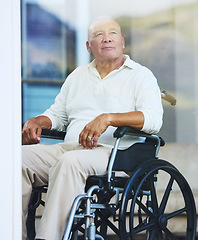 Image showing Retirement, window and elderly man in wheelchair thinking about life in luxury Portugal nursing home, estate or village. Senior Care, disability and homecare for disabled person with support and help