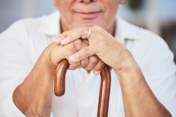 Image showing Old man hands, walking stick and disability from osteoporosis, arthritis and aging. Closeup of lonely, retirement and disabled senior widower with dementia, pain and wooden cane for support