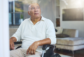 Image showing Disabled, sad and senior man thinking of accident in a wheelchair by the window in the living room in his house. Elderly man with depression, disability and retirement idea in a nursing home