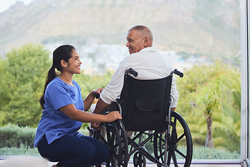 Image showing Disability healthcare, doctor and senior patient with support from medical nurse in a wheelchair. Disabled elderly man consulting with a happy nurse or caregiver after an accident in a nursing home