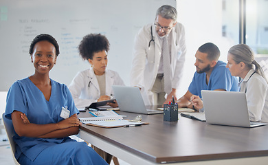 Image showing Medical meeting, portrait and African doctor working in seminar with employees at a hospital. Proud, happy and black woman nurse with arms crossed and support for healthcare during workshop at clinic