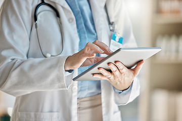 Image showing Doctor, office and tablet for research, email or communication. Medic, hospital and reading article, data or health magazine on web, while working with technology in healthcare center or clinic