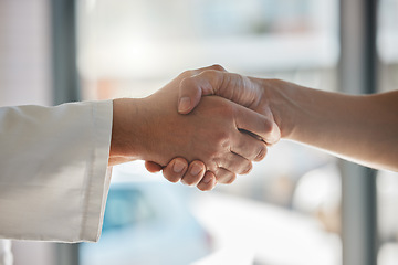 Image showing Handshake, deal and business partnership or agreement, closeup at office window. Shaking hands, thank you and a corporate welcome to new recruit or partner. Hand shake at meeting for collaboration