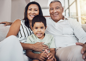 Image showing Family, child and grandparents or foster parents with adopted child sitting on the sofa at home with smile and love. Portrait of boy kid with man and woman parents bonding in their puerto rico house