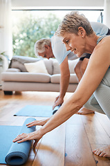 Image showing Senior couple, rolling yoga mat and home workout, fitness and exercise on living room floor. Elderly people on lounge ground for pilates training, healthy lifestyle and balance body wellness together