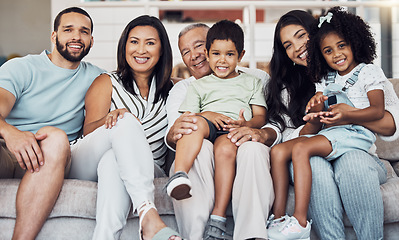 Image showing Family, sofa and happy in living room in portrait together in home or on vacation. Children, parents and grandparents love, happiness and smile while on holiday, in hotel or house in Houston, Texas